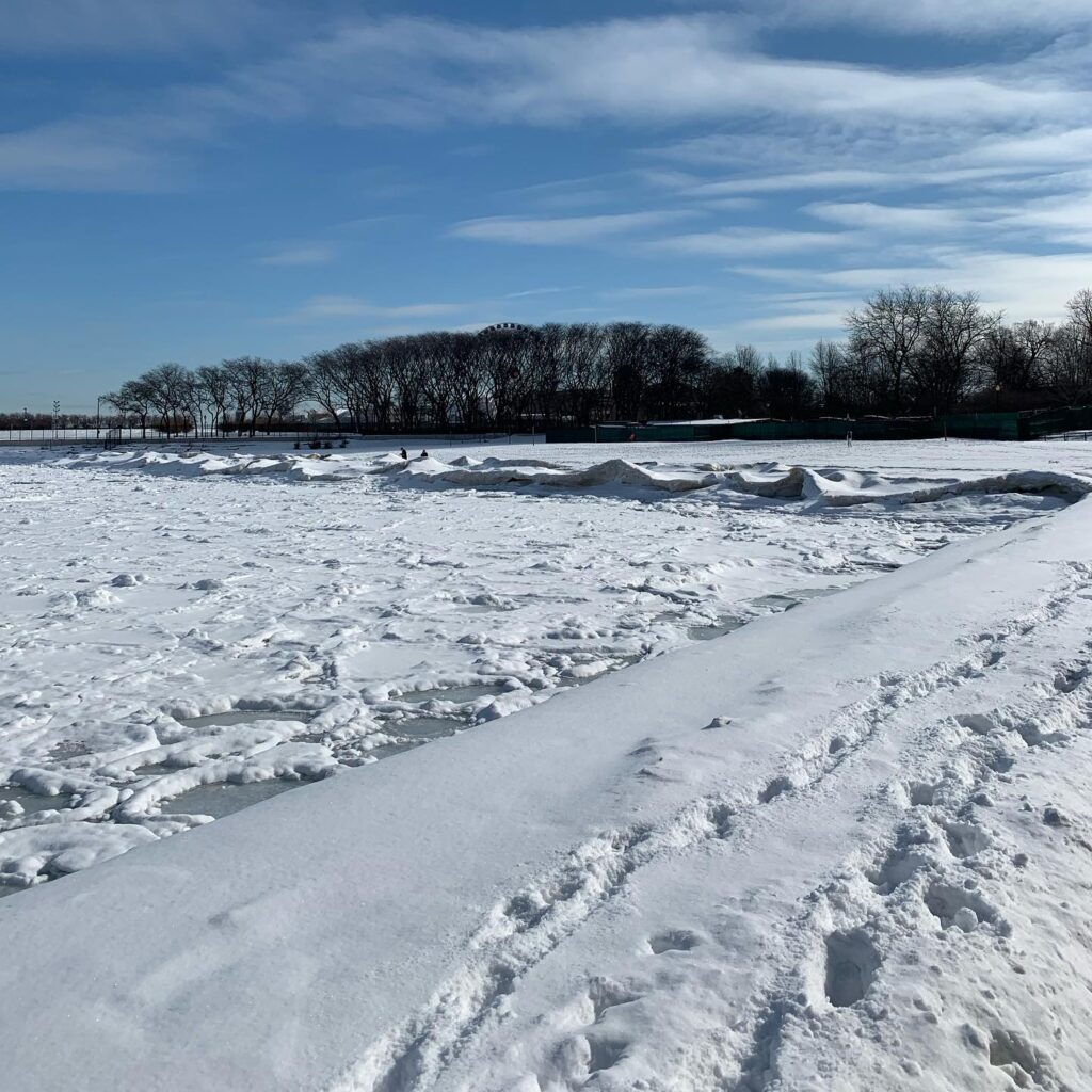 Winter in Chicago - The Michigan Lake at Ohio St. Beach, completely covered with snow